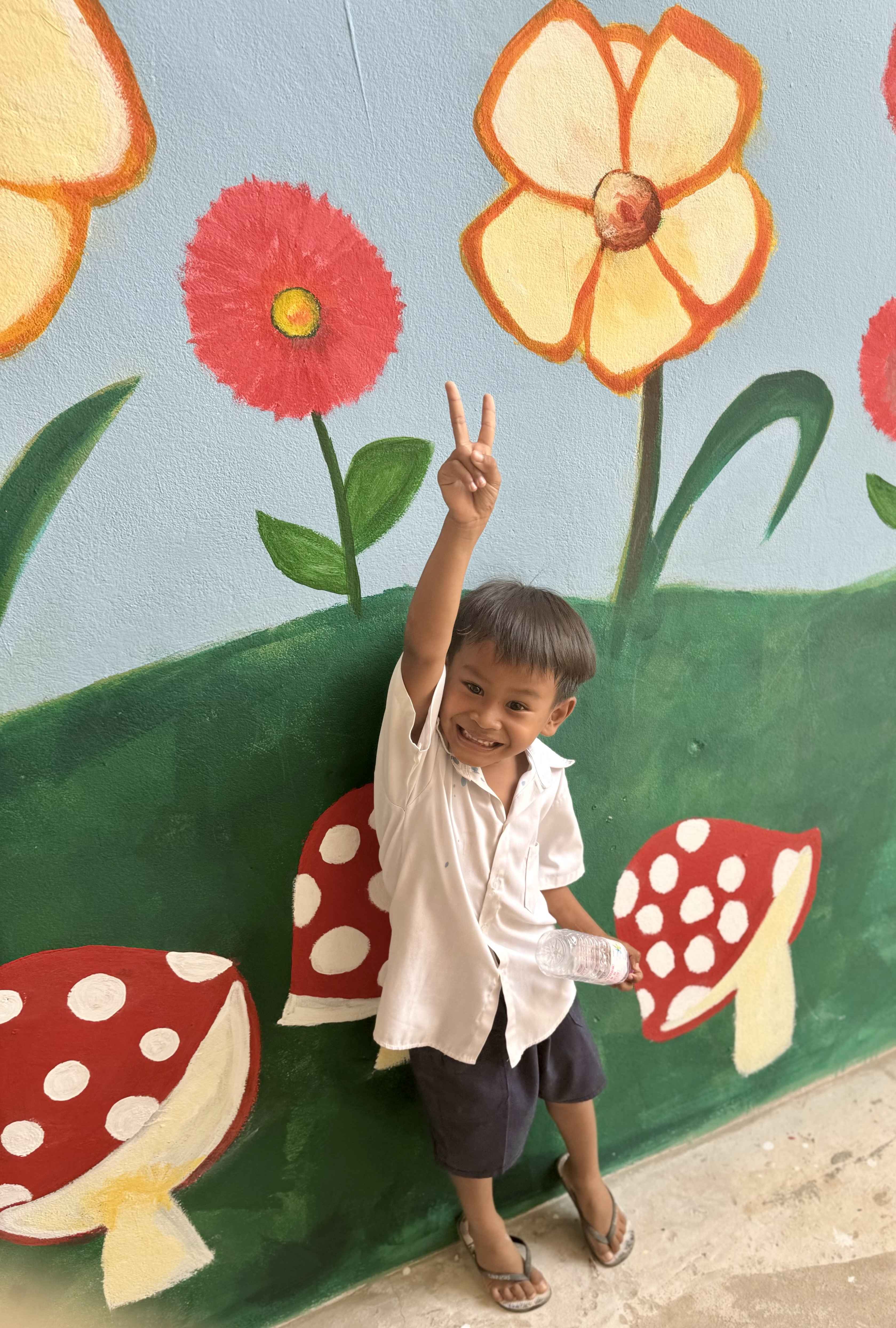 Peace sign child in cambodia
