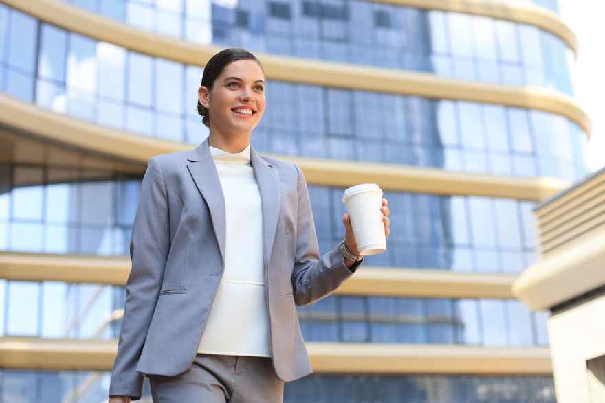 portrait-successful-business-woman-going-work-with-coffee-walking-near-office-building-city-street