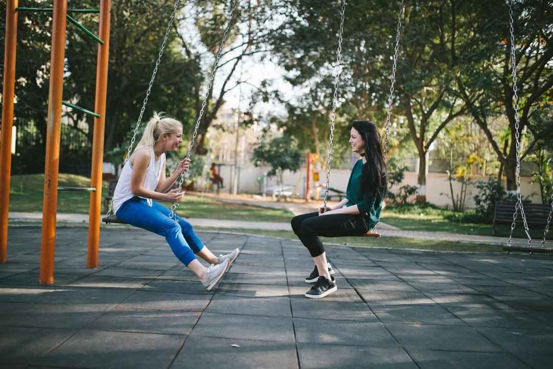 women on swings