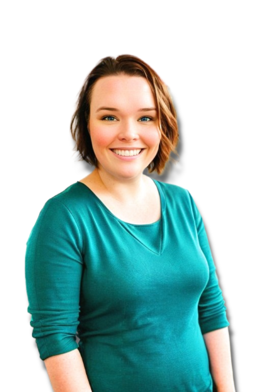 Candace Brooke EFT Tapping Stress & Resilience Coach smiles at the camera. She is standing on a beach at sunset.