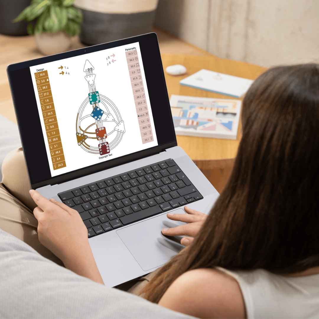 Woman looking at a human design chart on her laptop