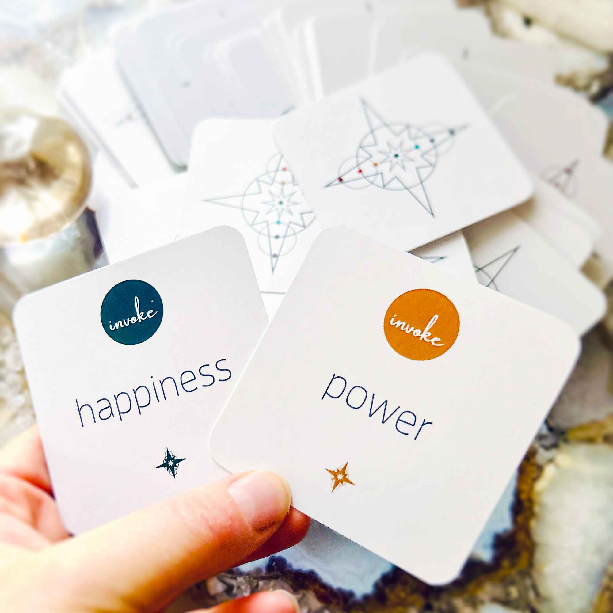 Star Cards Oracle Deck with Invoke happiness and invoke power cards being held