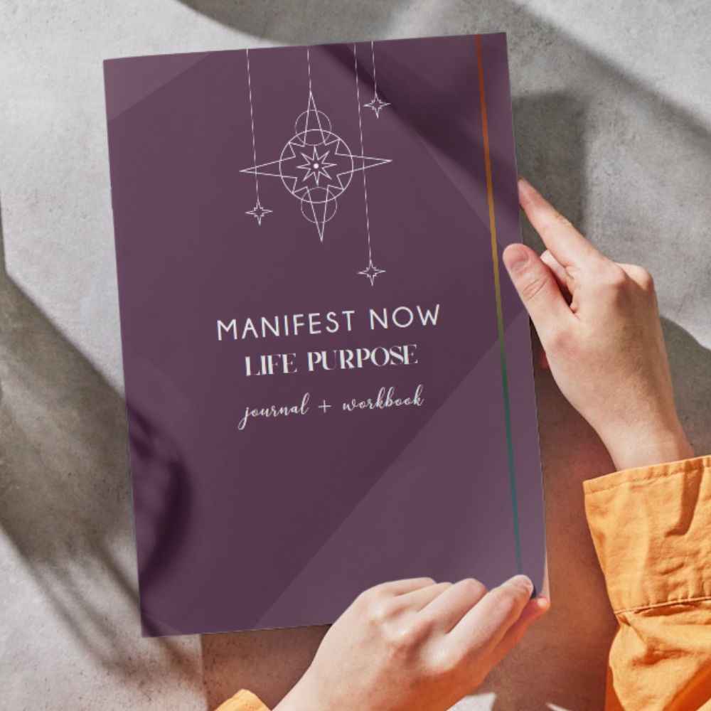 Manifest Now LIFE PURPOSE Journal by Amy Patee on a table