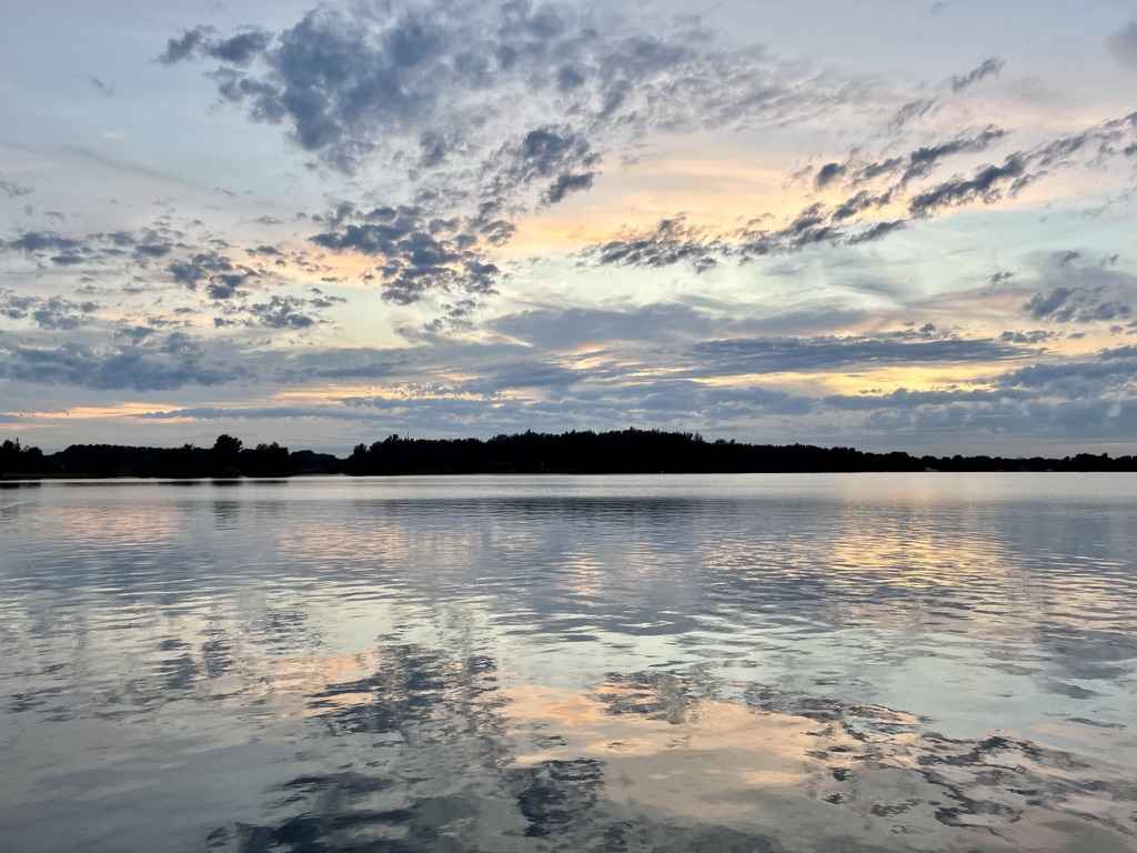 Gorgeous clouds reflected in a lake, freedom