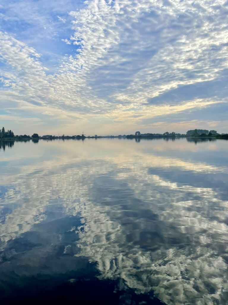 Clouds reflected in the water of the lake, quiet, still, free