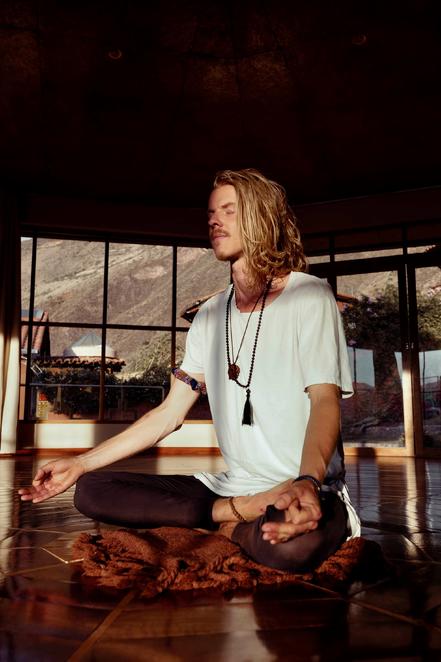 Jordy Jaarsma meditating in a yoga studio overlooking the Sacred Valley