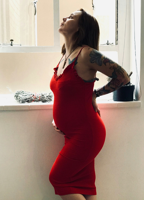 pregnant woman in a red dress