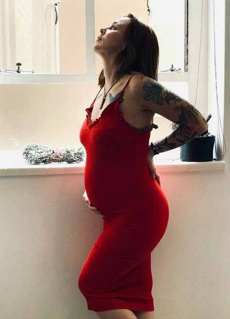 pregnant woman in a red dress