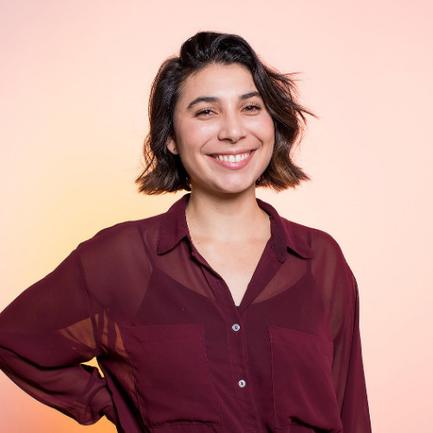 Cheyenne professional photo, smiling, confident, wearing a maroon blouse
