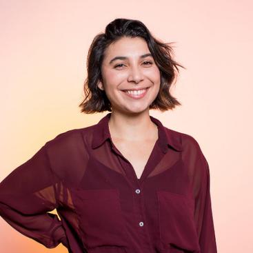 Cheyenne professional photo, smiling, confident, wearing a maroon blouse