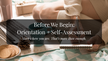 Close up of a woman's hands writing in a journal beside her laptop. She is set up on the floor on a light colored blanket, with a mug of tea and cookies.