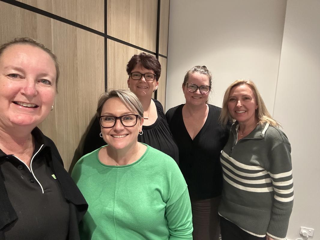 Marianne Tansley with four attendees at the Sydney Thrive in a Day event - all smiling after a day's work