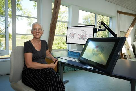 Ingrid at the computer in the barn studio