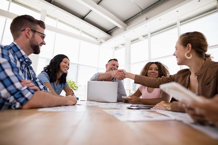 executives-shaking-hands-in-the-meeting-2M4XTHF