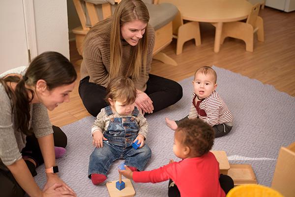Montessori infants and guides in the classroom.