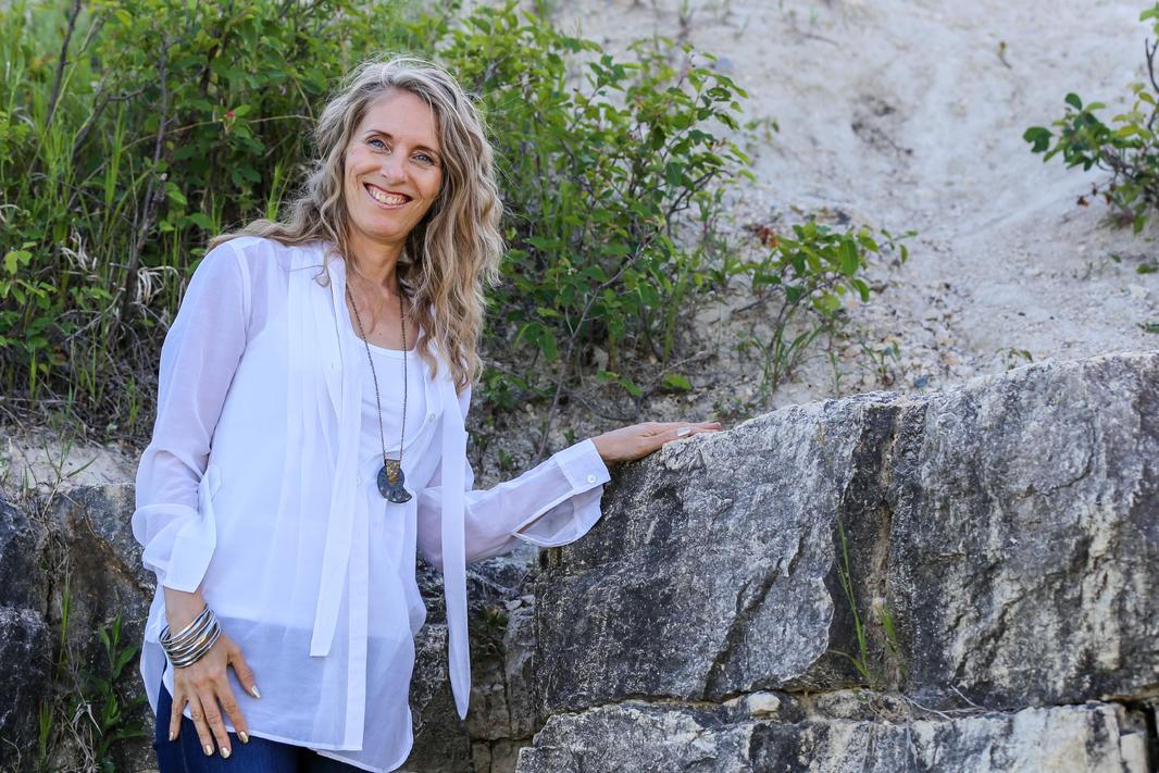 beth in white with rocks