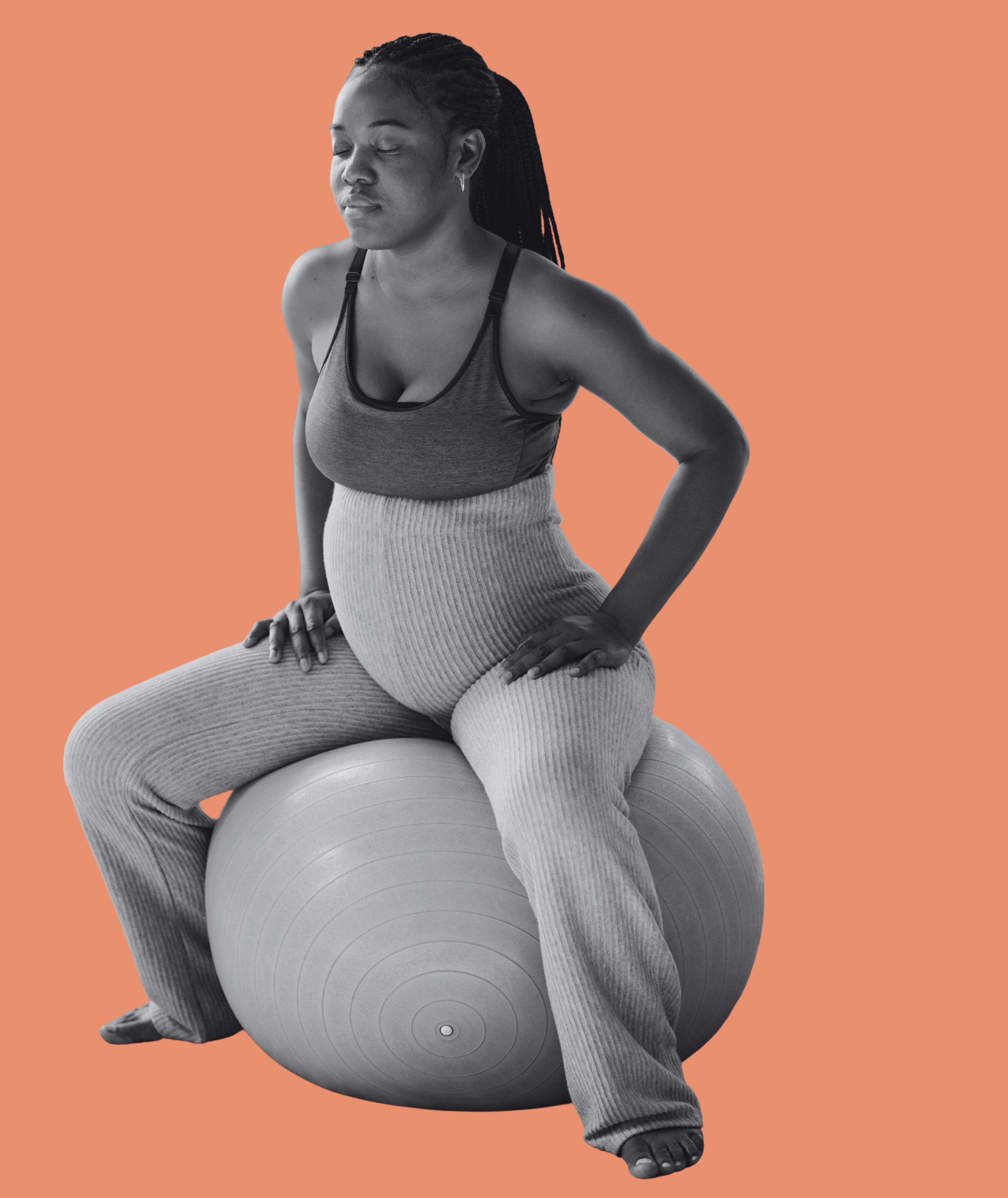 pregnant woman sitting on a birth ball