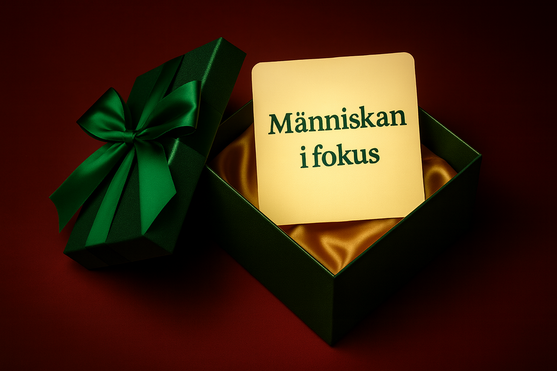 Gåva med satinband och meddelande