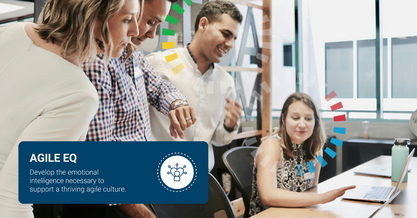 A business team is overlooking laptops on a board room table, that shows their leadership development DiSC assessment smiling and talking