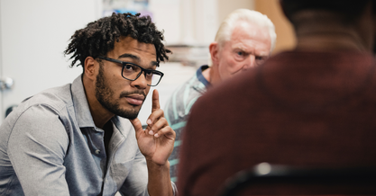 Zoomed in image of a male listening intently to his executive leadership coach