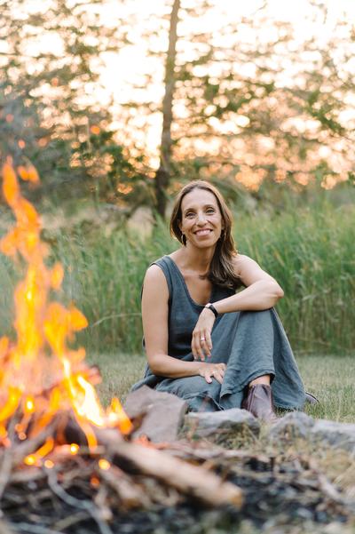 Sarah Selecky sitting near a fire