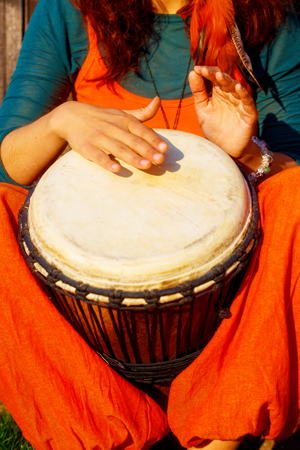 AdobeStock_145320983-woman-playing-djembe-sm