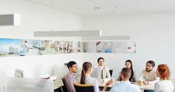 business team gathered around a boardroom table