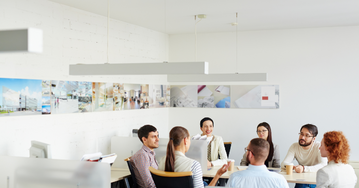 business team gathered around a boardroom table