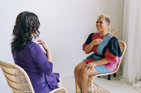 An individual taps on her chest following Dr. Jill Wener's instruction.