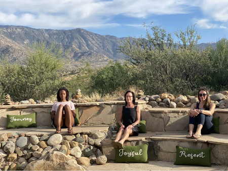 Women healthcare professionals meditate comfortably outside at the Miraval Spa in Arizona, following Dr. Jill Wener's meditation instruction.