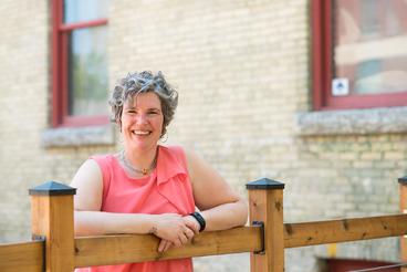 Louise Neil with an invitationalsmile