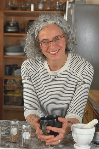 dana lavoie in her kitchen with herbs