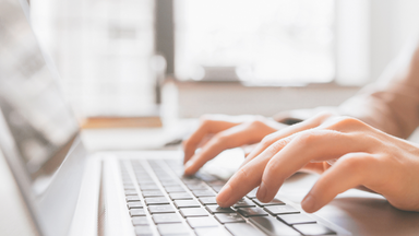 typing on laptop