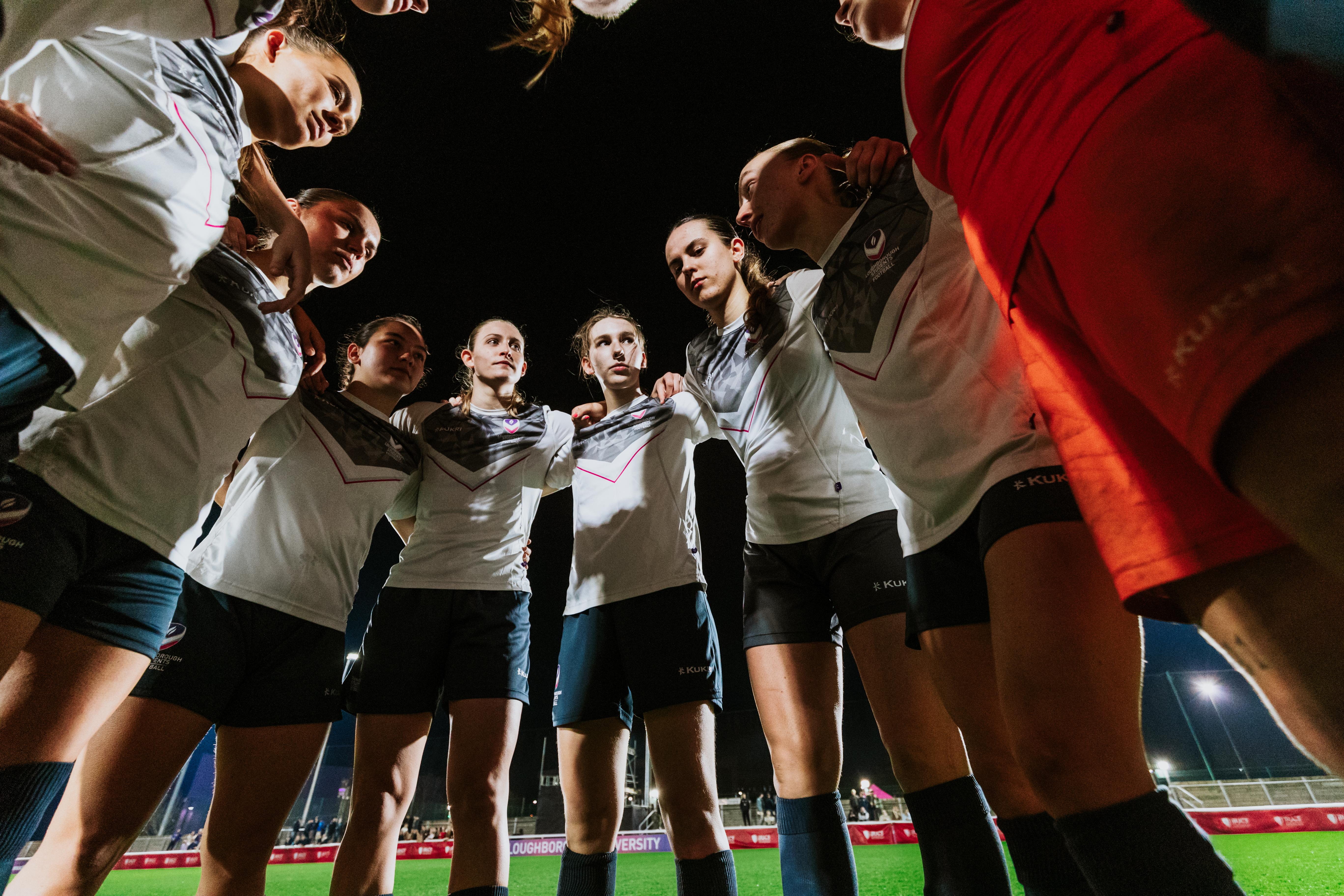 girls football huddle