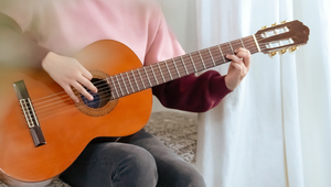 A guitarist with an acoustic guitar