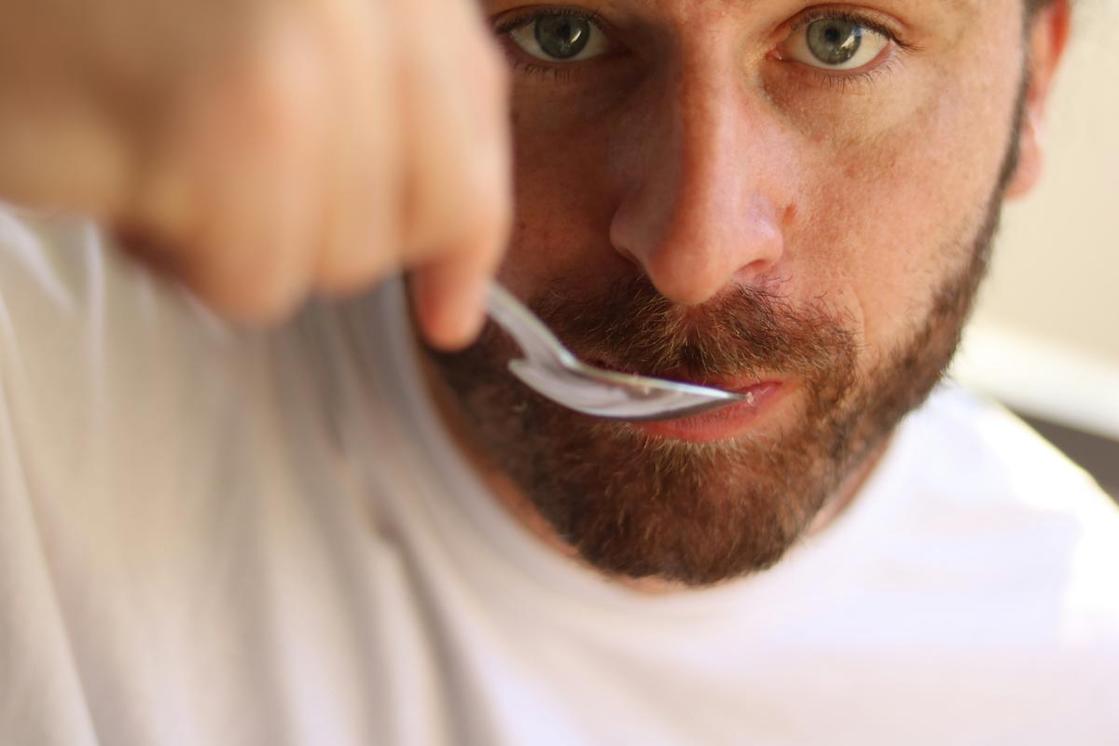 man eating sugar