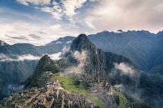 Mist rolling over the green peaks of Machu Picchu, Peru