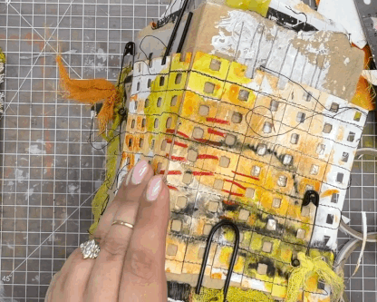 Poking holes with an awl to bind a journal