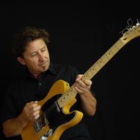 Man playing an electric guitar
