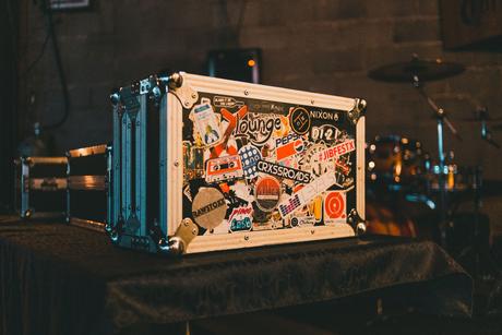 Road case with stickers all over it