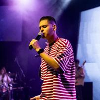 A man singing with a microphone