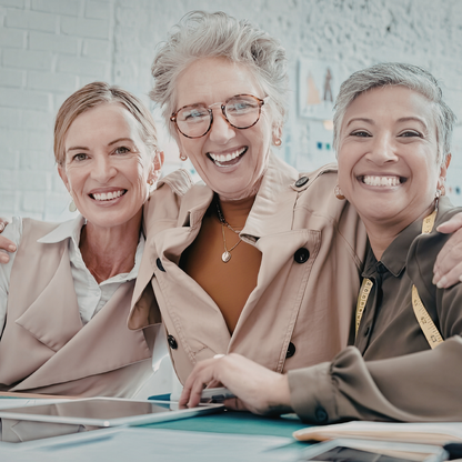 three women smiling at the camera