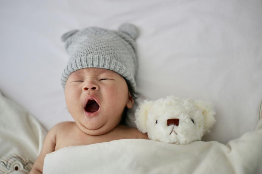 Yawning Baby with teddy