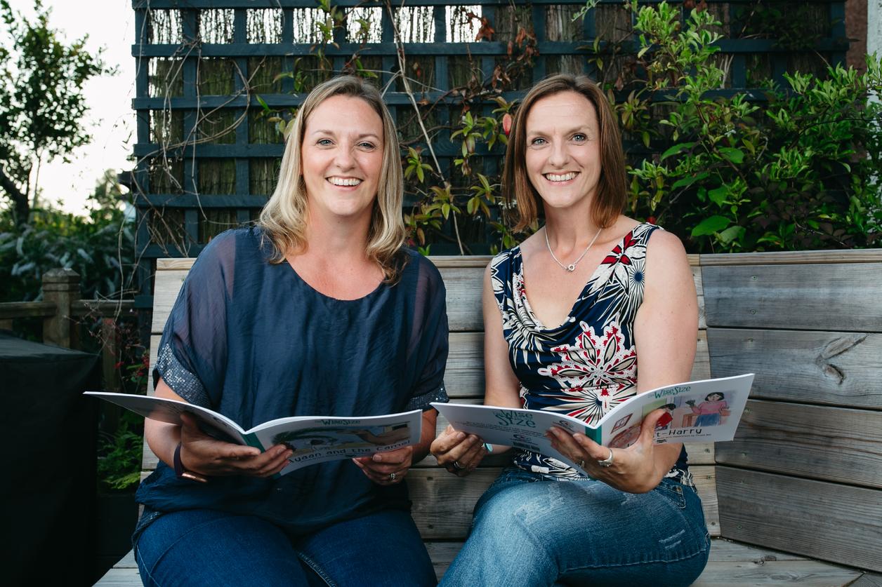 The Wee Coaching Company Lorna and Jac holding Wize for My Size books