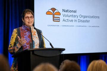 Emma Churchman on stage at NVOAD