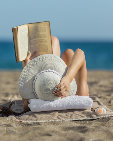 Lady on Beach reading a book