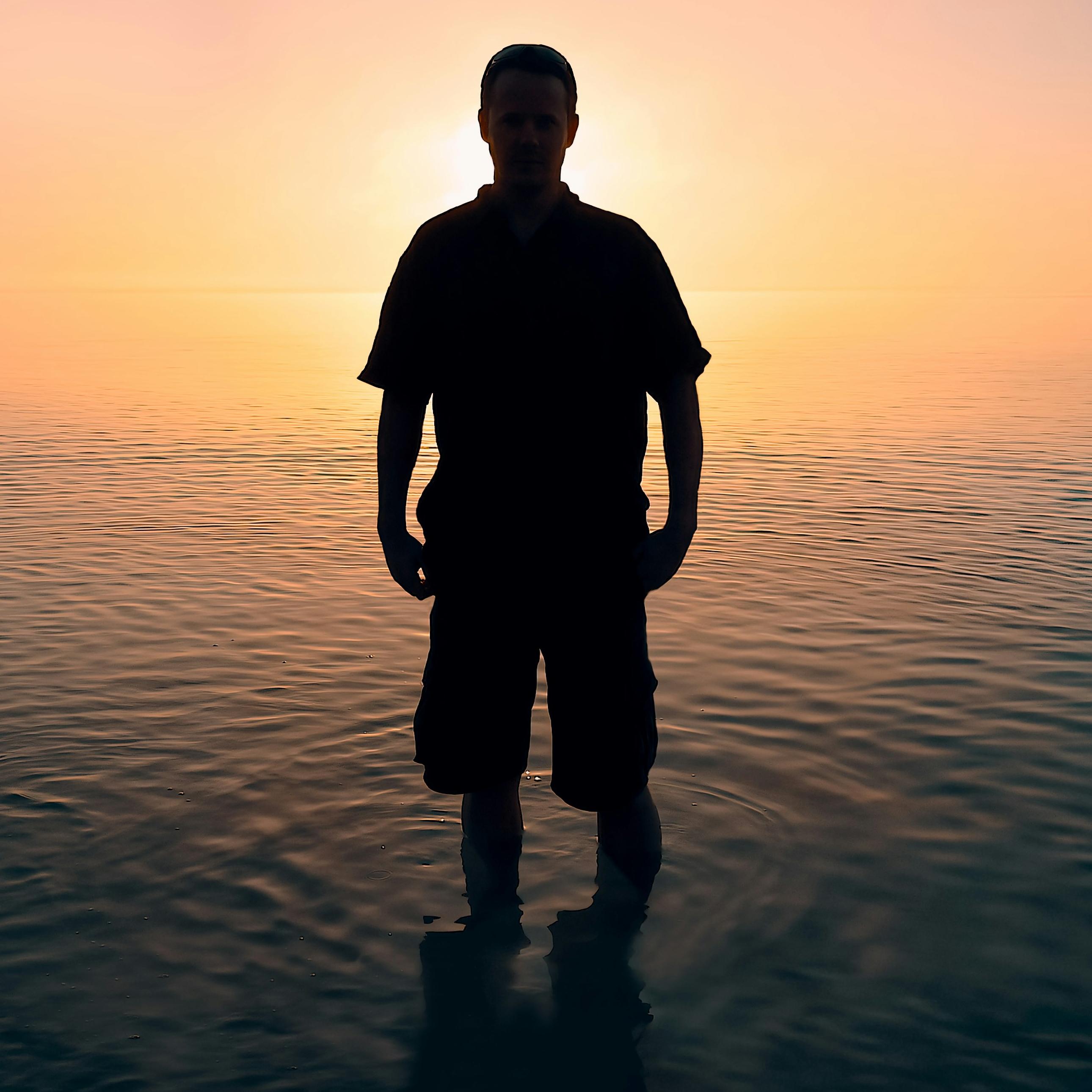man standing on body of water