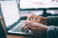 Picture of someone at a laptop