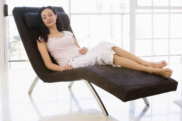 woman-sitting-in-chair-sleeping-900x600