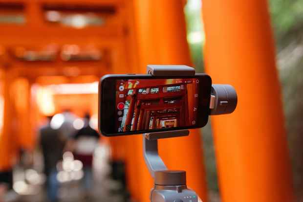 phone videoing orange stage